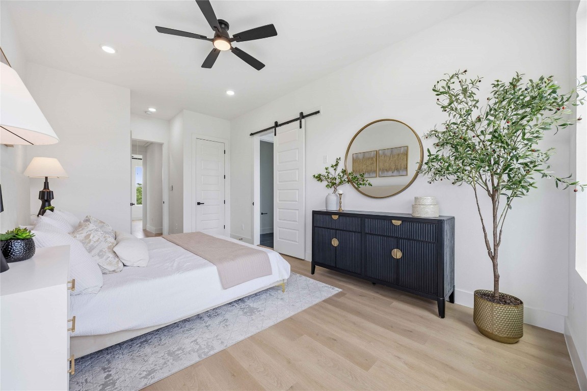 3103 Lelia Street, Unit B Houston, TX 77026 - Photo 23 of 30 a bedroom with a bed and a potted plant
