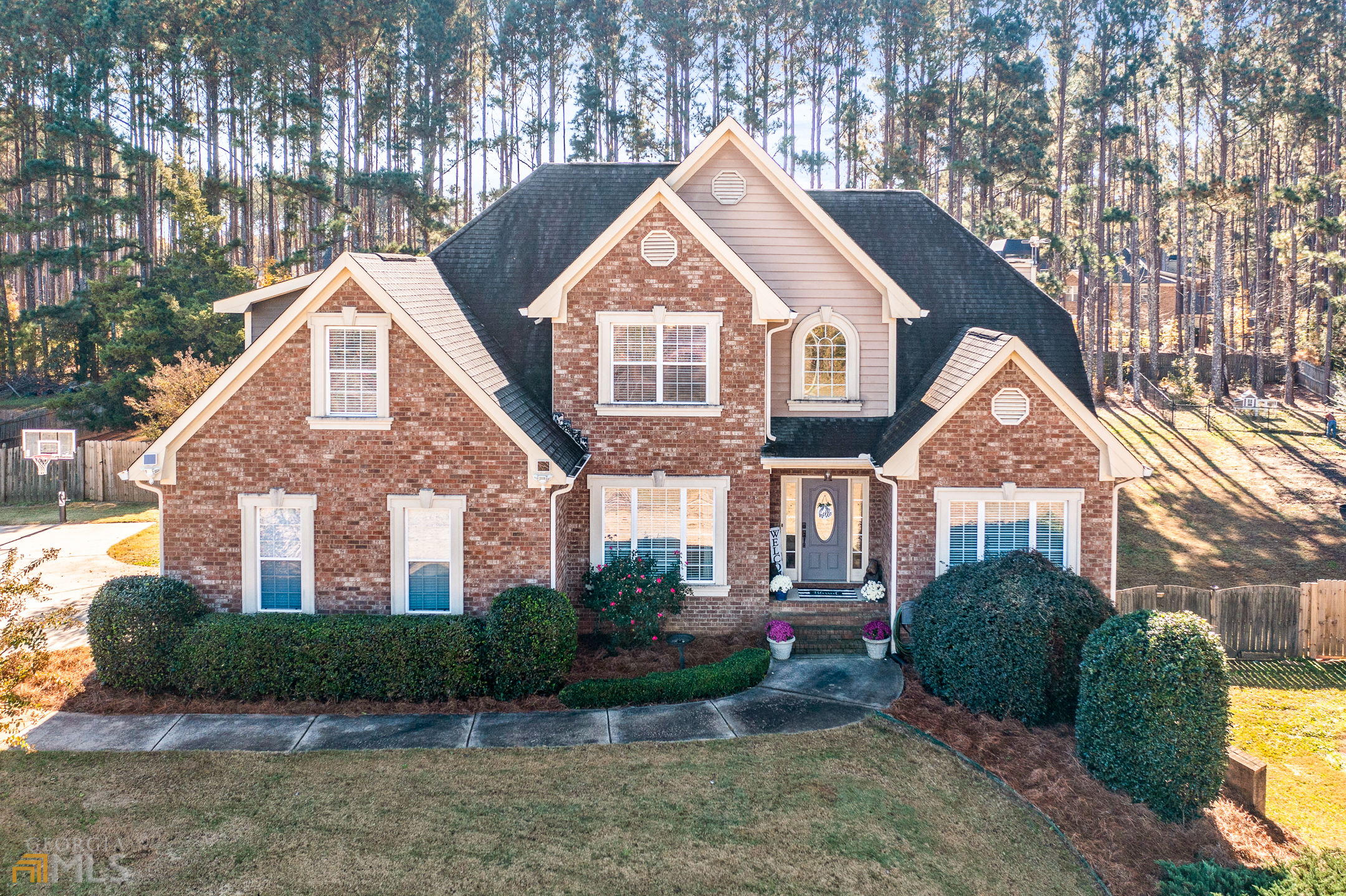 a front view of a house with garden