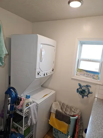 a living room with a bed and furniture