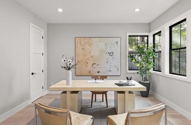 a view of a dining room with furniture and window
