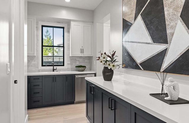 a kitchen with a sink and cabinets