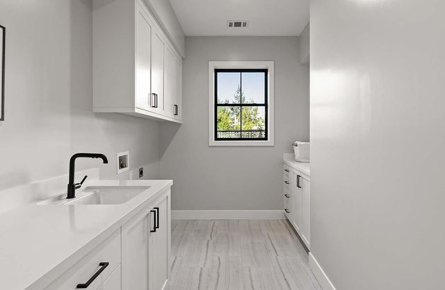 a bathroom with a sink and a window