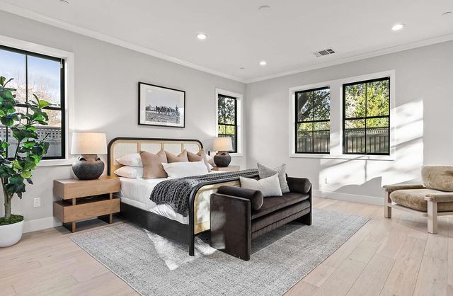 a spacious bedroom with a bed and a couch