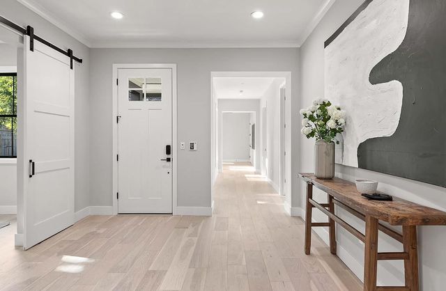 a view of kitchen with furniture and wooden floor