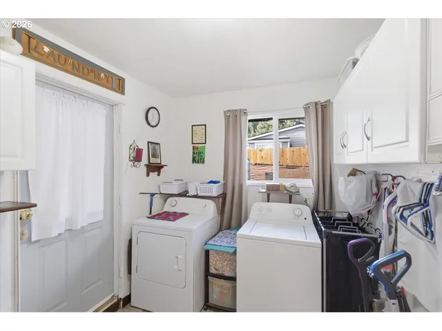 a room with a washing machine and sink