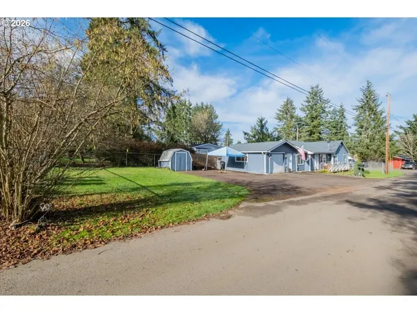 a view of a street with a building in the background