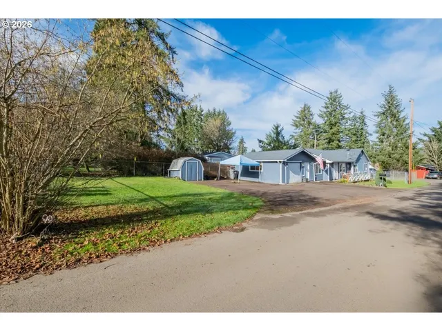 a view of a street with a building in the background
