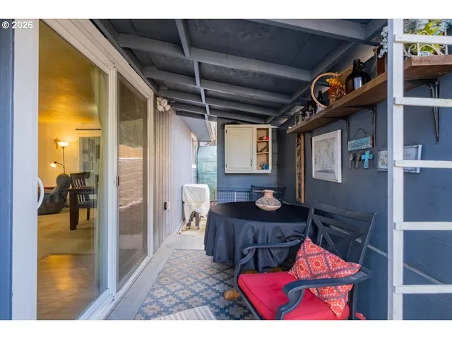 a view of a livingroom with furniture and front door