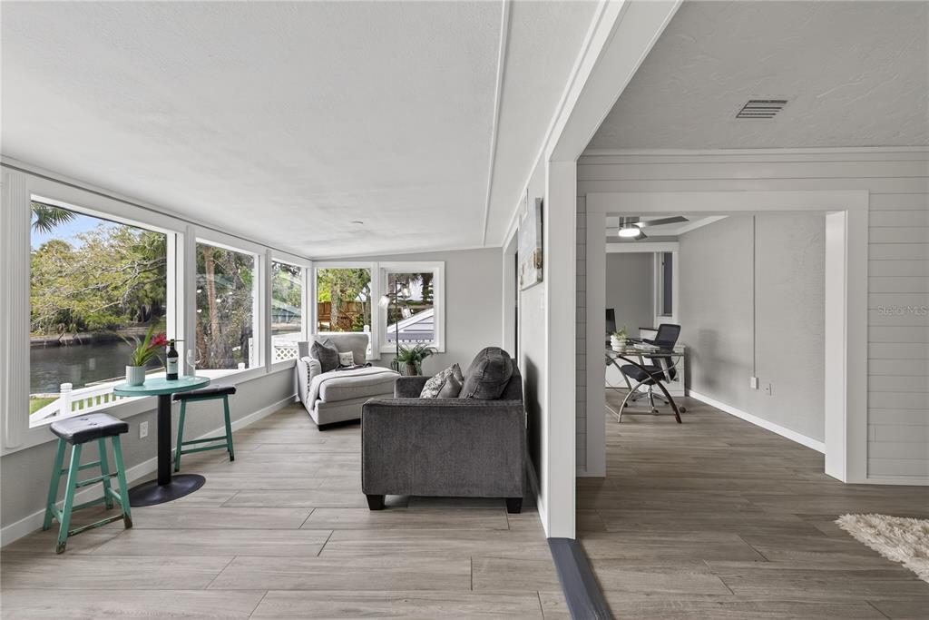 5851 Rio Drive New Port Richey, FL 34652 - Photo 12 of 50 a living room with furniture and a large window