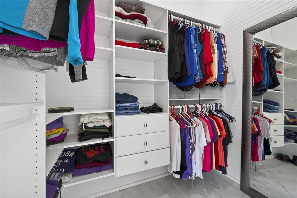 5851 Rio Drive New Port Richey, FL 34652 - Photo 25 of 50 a view of walk in closet with clothes and shoes