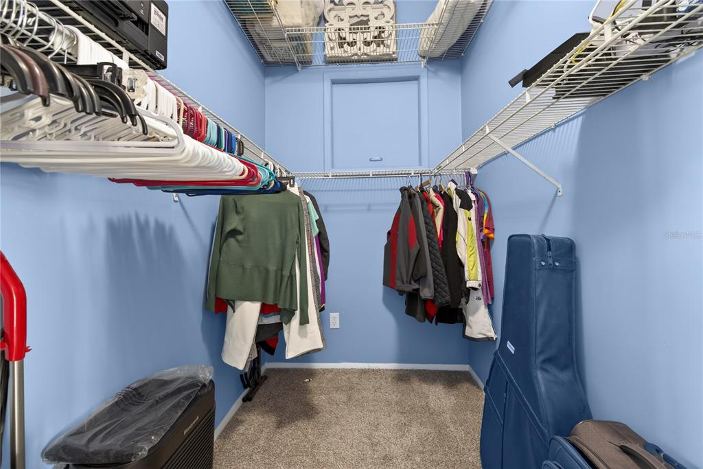 5851 Rio Drive New Port Richey, FL 34652 - Photo 28 of 50 a view of walk in closet with clothes and shoes