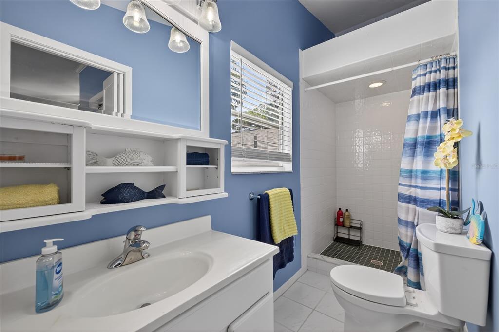 5851 Rio Drive New Port Richey, FL 34652 - Photo 30 of 50 a bathroom with a sink toilet and shower