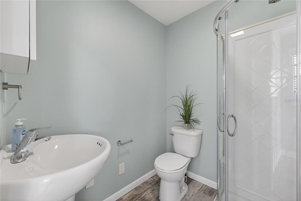 5851 Rio Drive New Port Richey, FL 34652 - Photo 34 of 50 a bathroom with a sink a toilet and shower