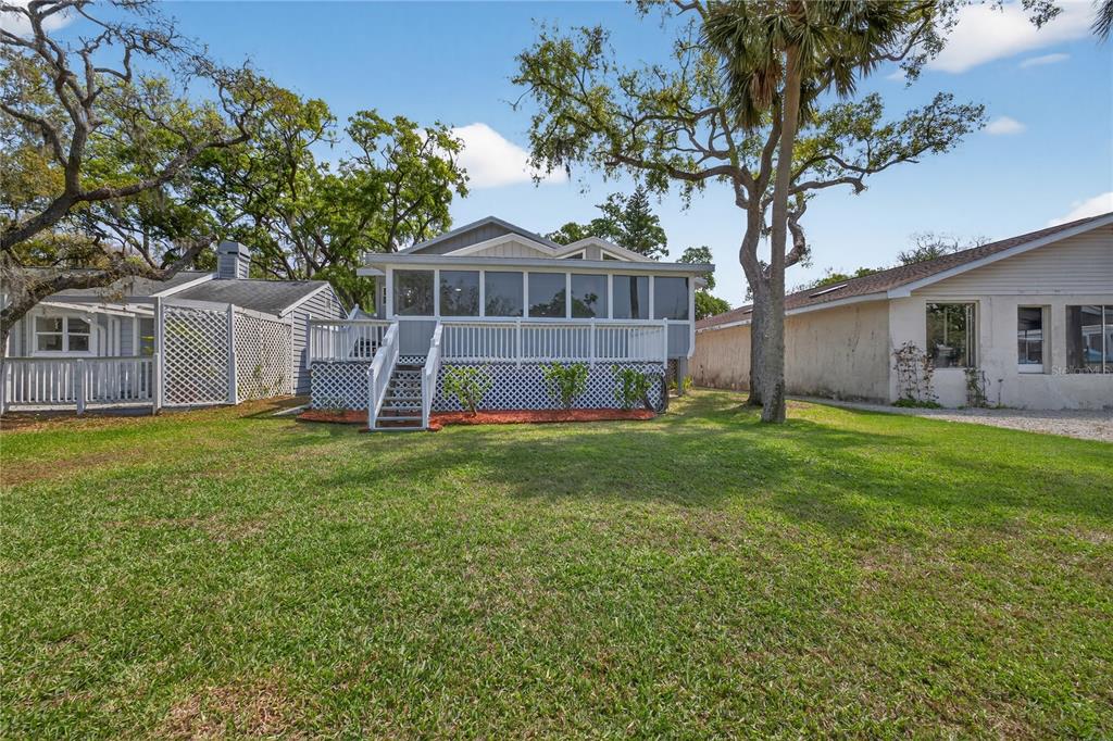 5851 Rio Drive New Port Richey, FL 34652 - Photo 36 of 50 a front view of a house with garden