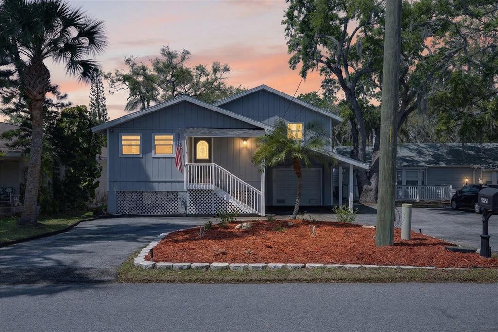 5851 Rio Drive New Port Richey, FL 34652 - Photo 41 of 50 a front view of a house with a yard