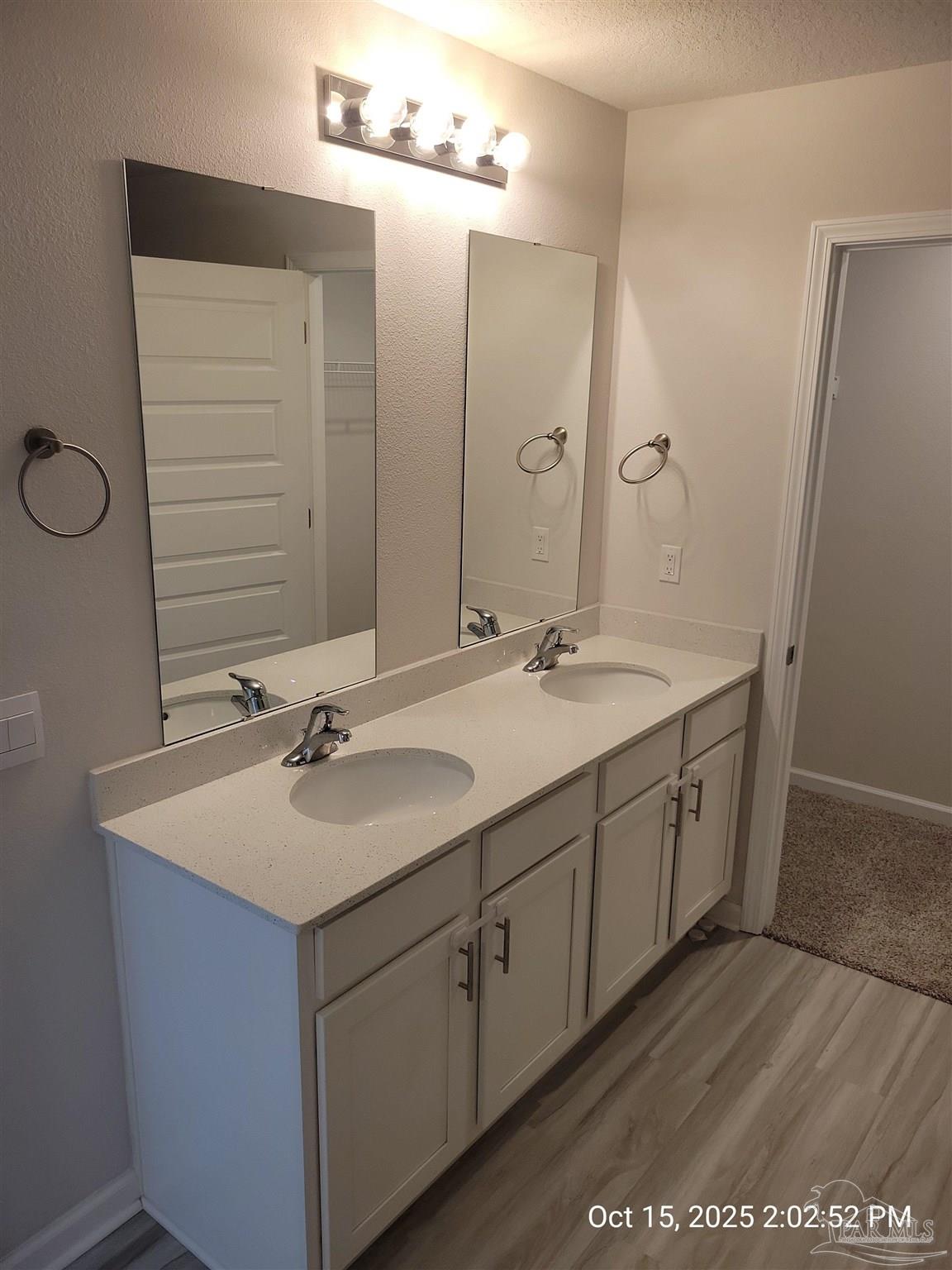 441 Scarborough Street Crestview, FL 32539 - Photo 11 of 13 a bathroom with a double vanity sink and mirror