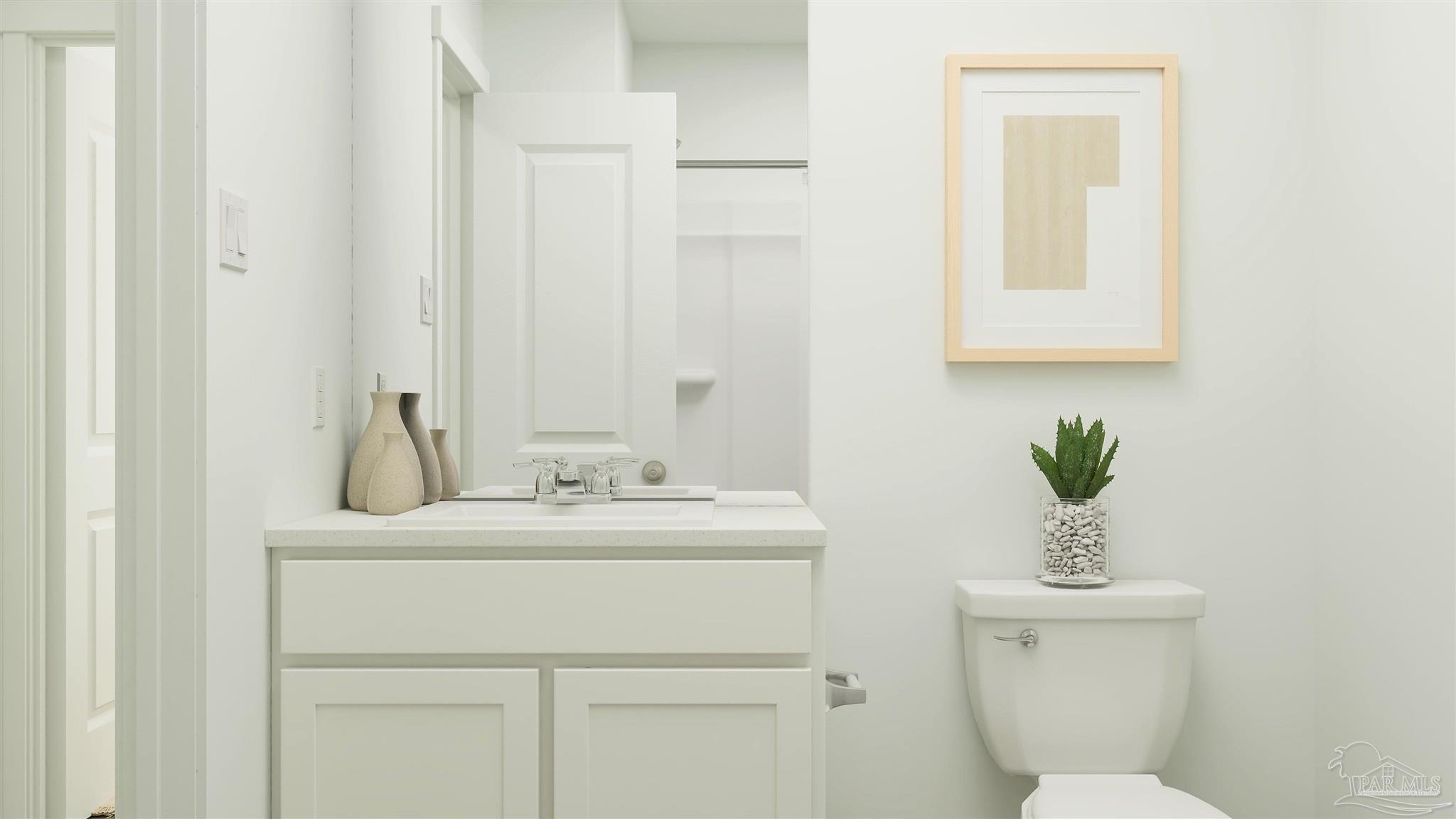 4749 Eagles Rdg Road Pace, FL 32571 - Photo 17 of 19 a bathroom with a toilet a sink and a mirror