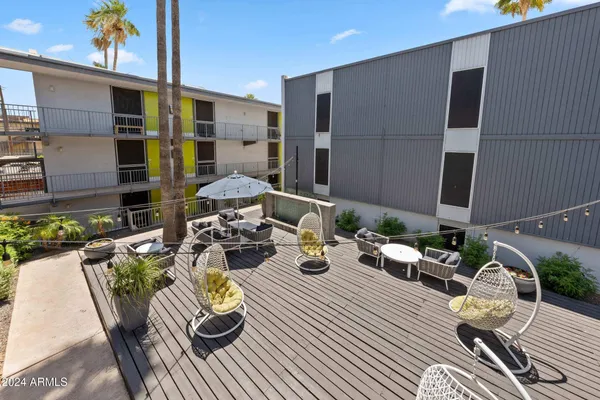 a view of a dinning tables and chairs in patio