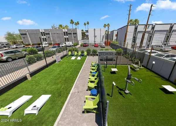 a swimming pool with outdoor seating and yard