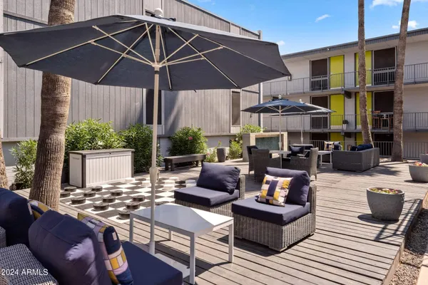 a outdoor space with patio the couches and a umbrella