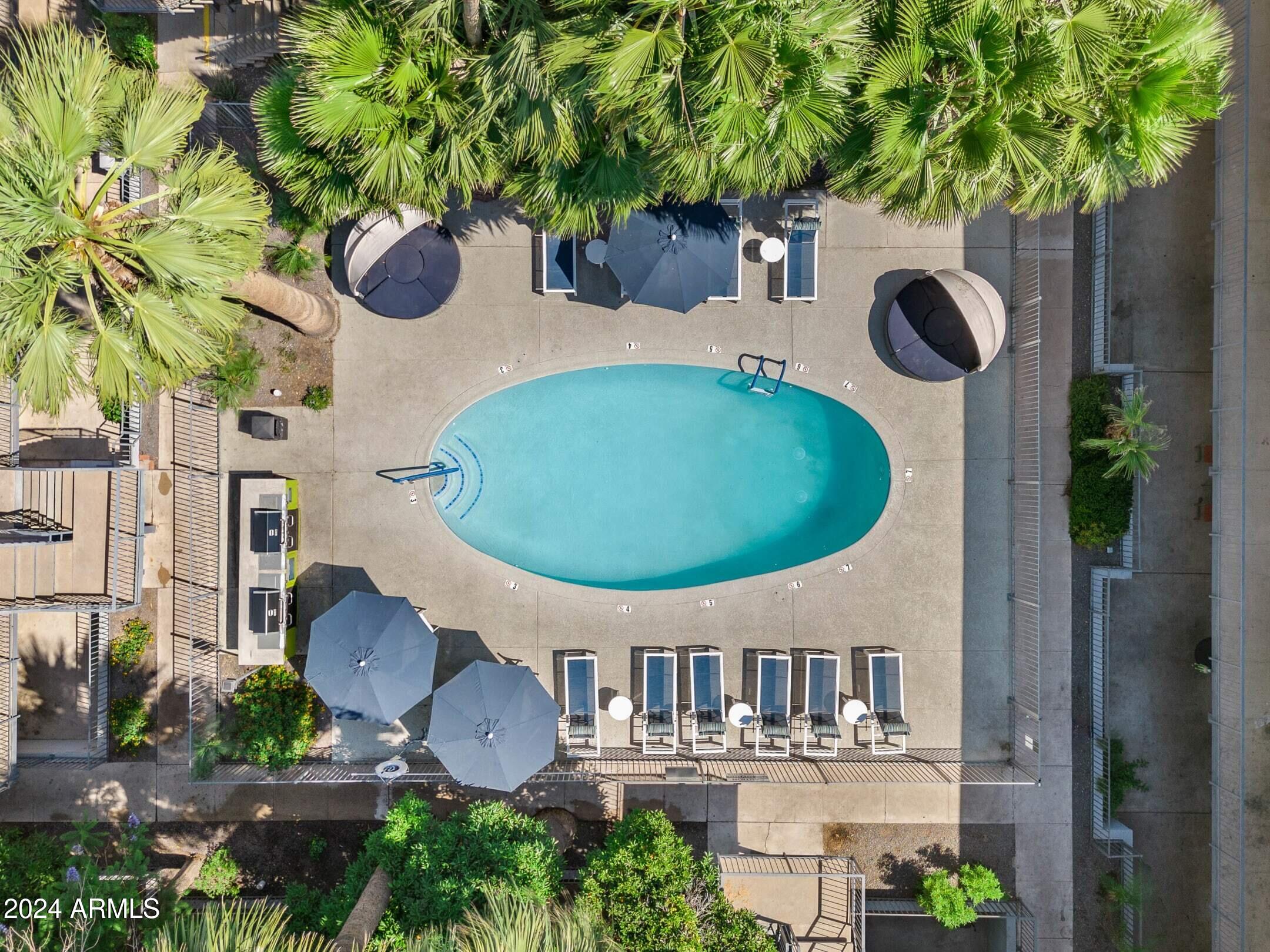 1601 West Camelback Road, Unit A10AW Phoenix, AZ 85015 - Photo 23 of 23 a backyard of a house with seating space and trees
