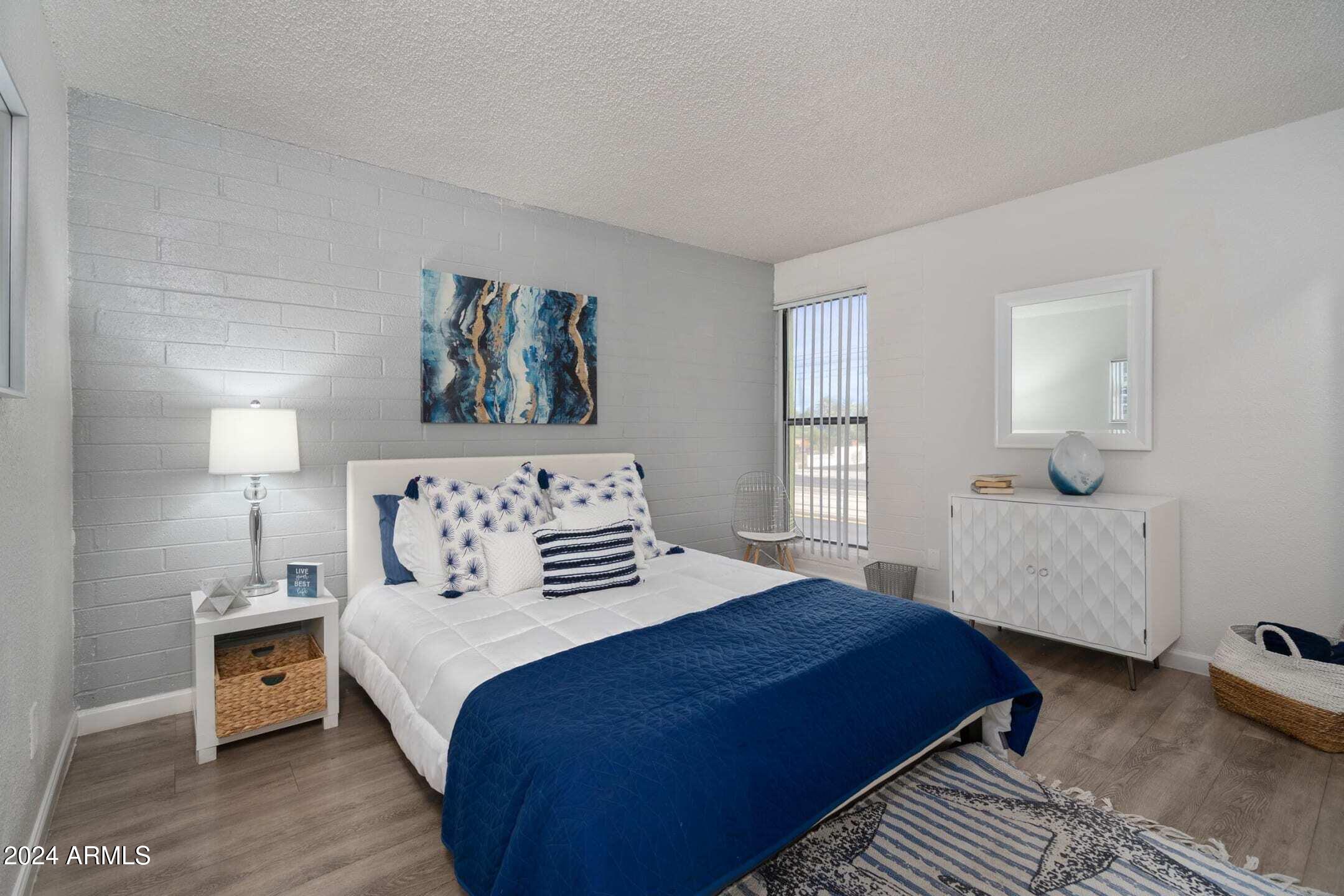 1601 West Camelback Road, Unit A10AW Phoenix, AZ 85015 - Photo 9 of 23 a bedroom with a large bed and a window