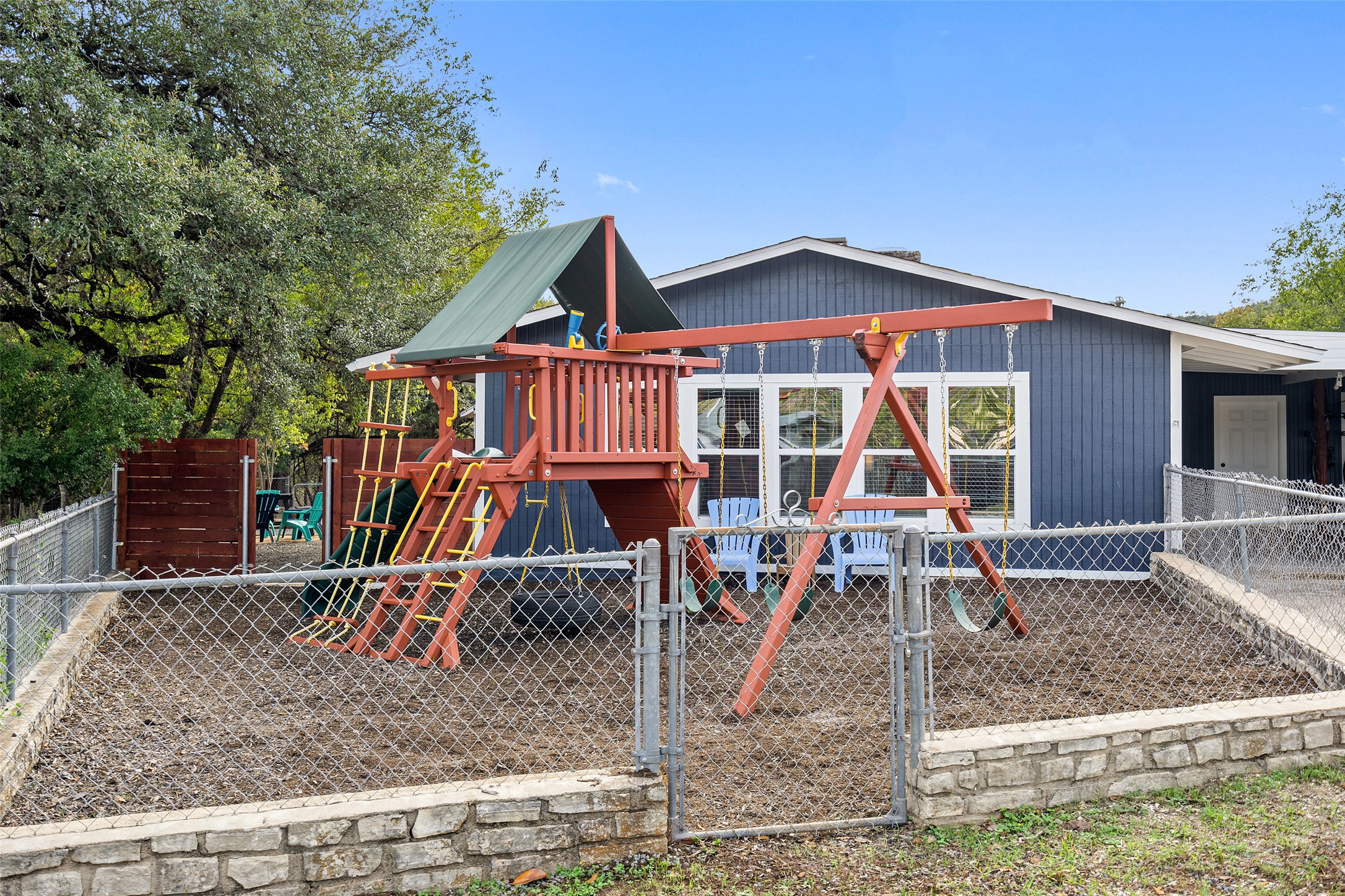 35 Presidio Road Wimberley, TX 78676 - Photo 35 of 37 The playground is fully fenced.