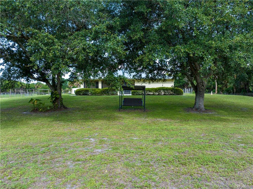 8200 Southwest Springhaven Avenue Indiantown, FL 34956 - Photo 8 of 35 a view of a park with large trees