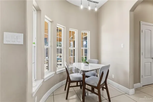 a view of a dining room with furniture and a window