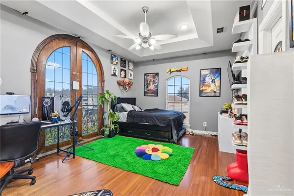 a living room with furniture and a floor to ceiling window