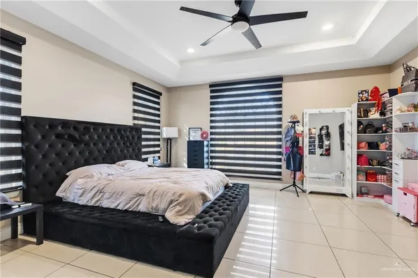 a bedroom with a bed and a walk in closet