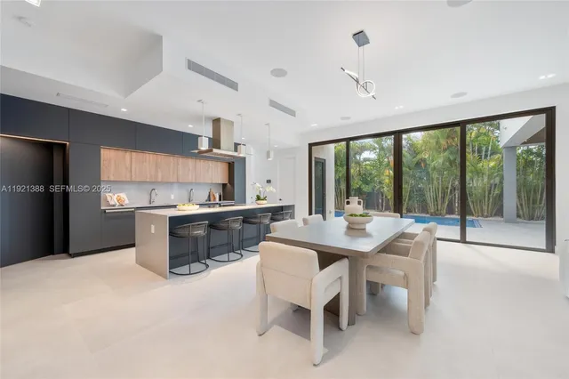 a kitchen with a table and chairs in it