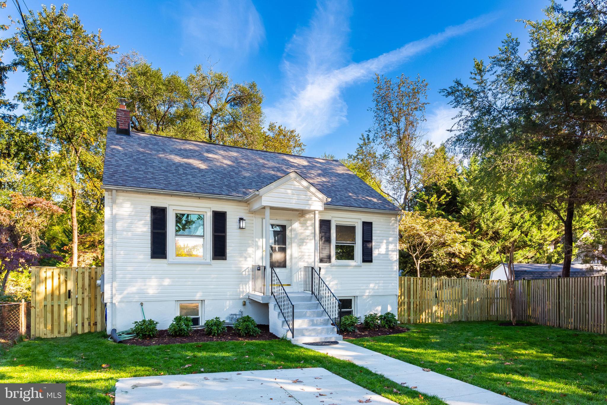 304 Franklin Place Silver Spring, MD 20901 - Photo 1 of 27 Charming home with lush greenery and blue skies.