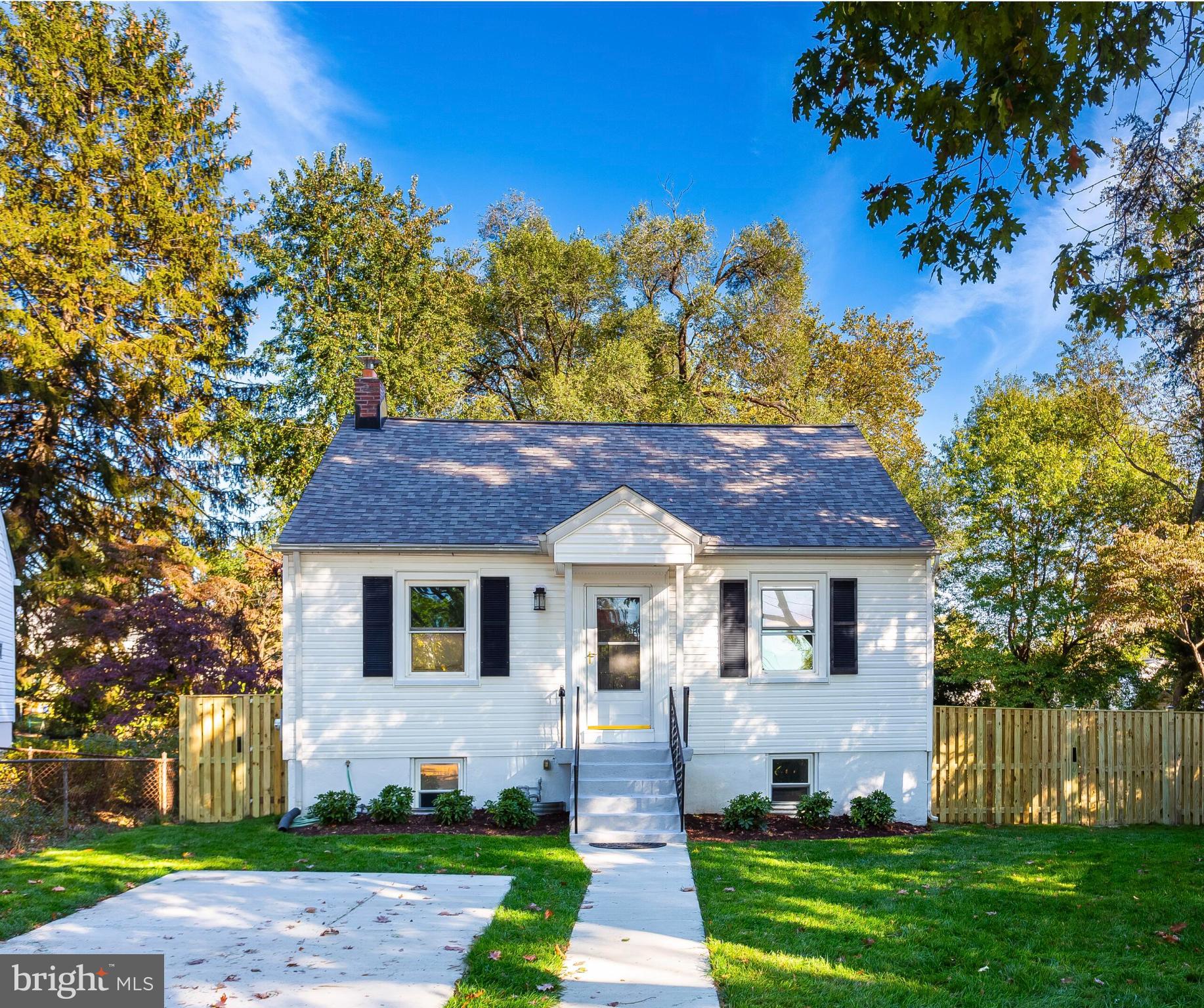304 Franklin Place Silver Spring, MD 20901 - Photo 3 of 27 Charming home with lush greenery backdrop.