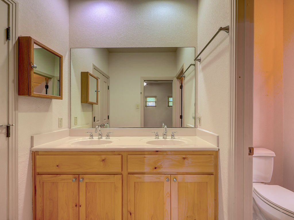 9707 Anderson Mill Road, Unit 22 Austin, TX 78750 - Photo 33 of 39 Double vanity with ample storage offers everyday convenience in this well-appointed bathroom.