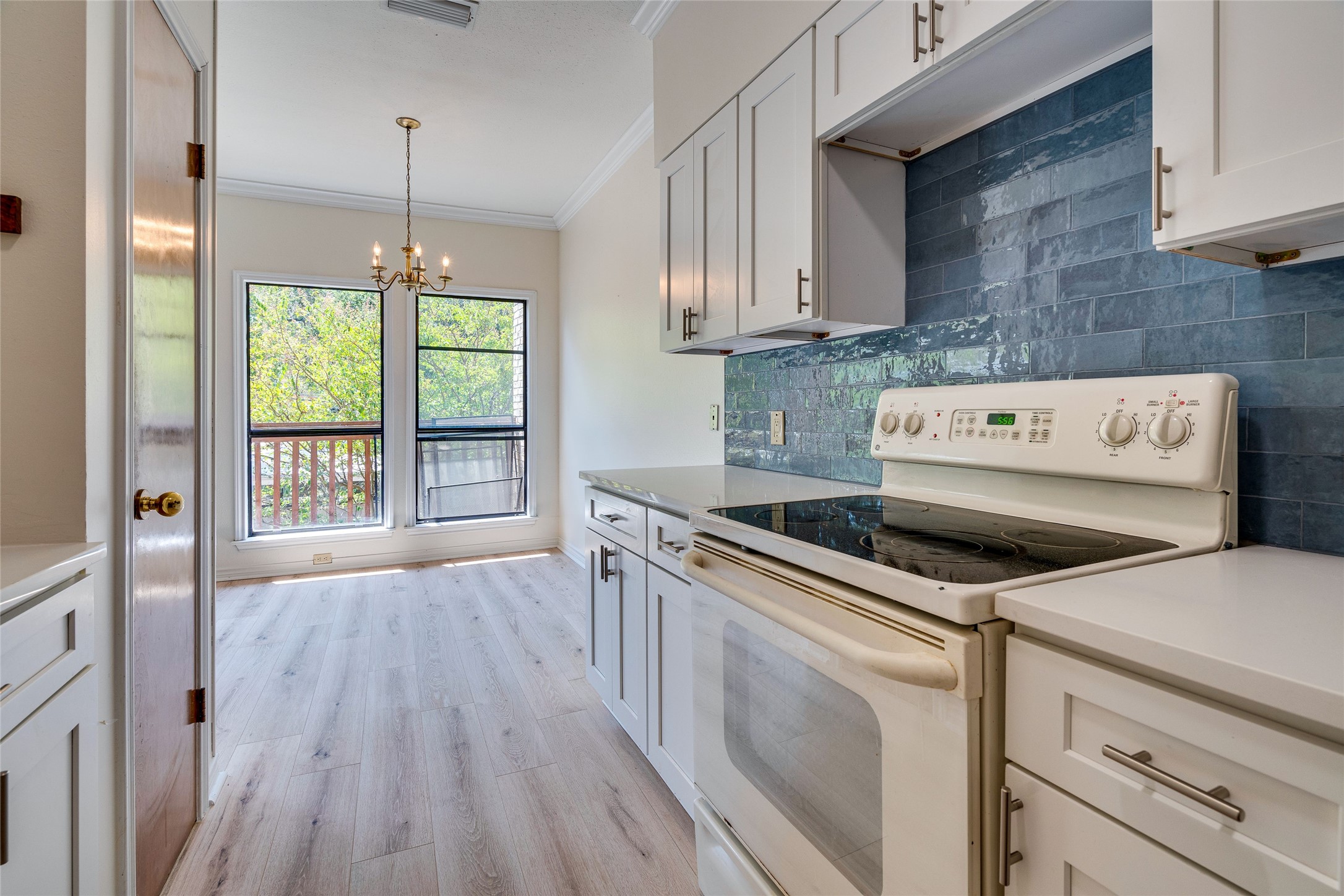 1406 Windsor Road, Unit 201 Austin, TX 78703 - Photo 15 of 32 a kitchen with a stove a sink and a refrigerator