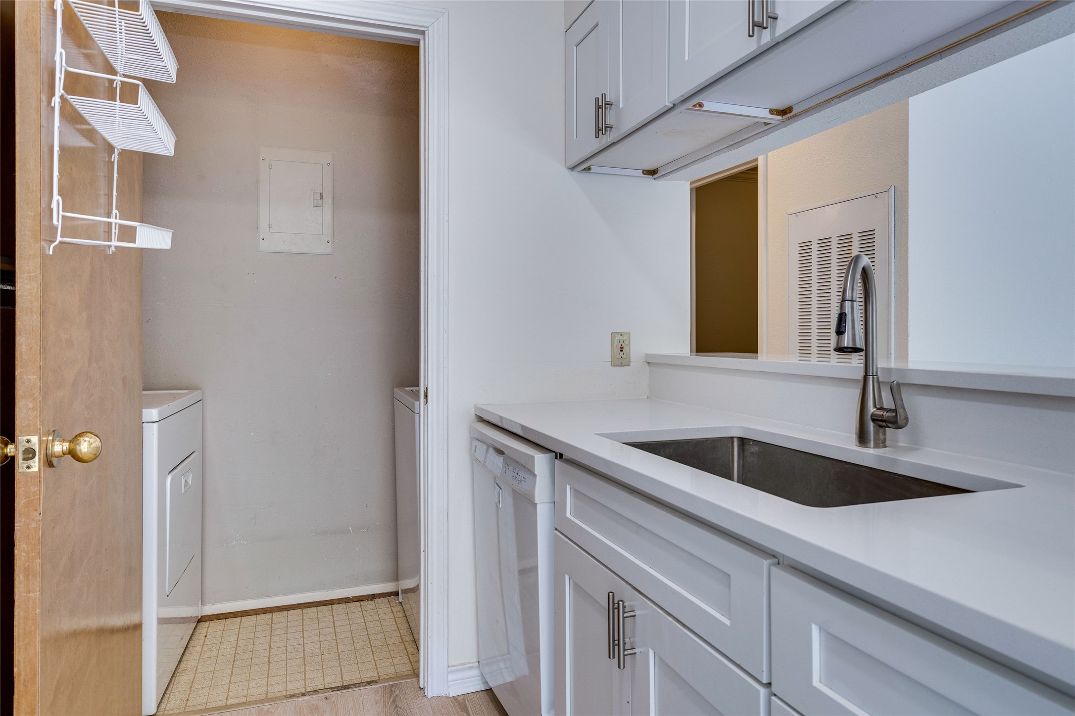 1406 Windsor Road, Unit 201 Austin, TX 78703 - Photo 16 of 32 a kitchen with a sink and refrigerator