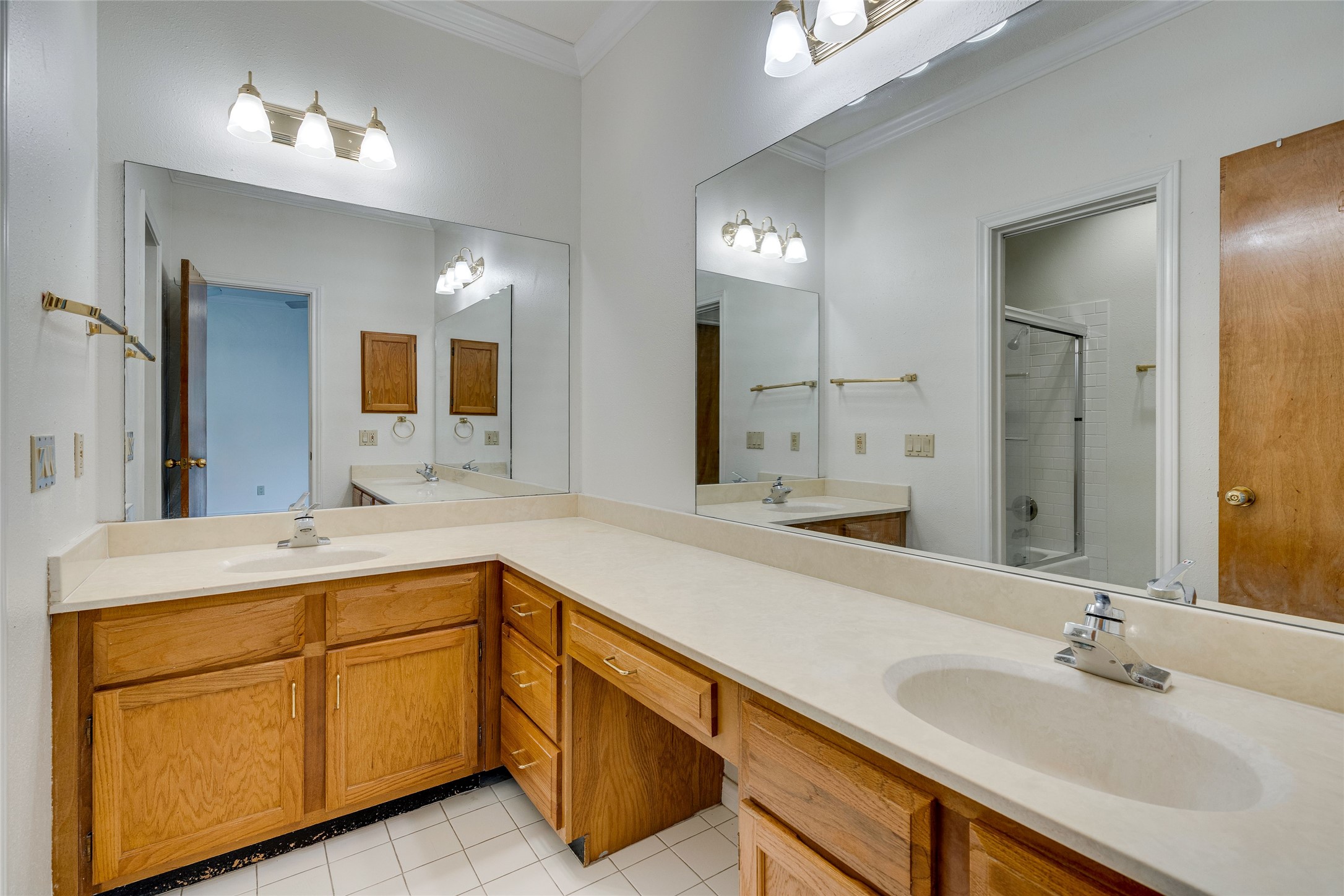 1406 Windsor Road, Unit 201 Austin, TX 78703 - Photo 21 of 32 a bathroom with a sink double vanity granite and a mirror