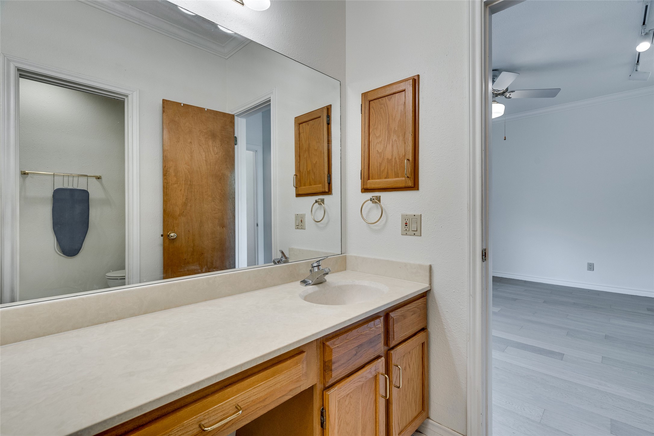 1406 Windsor Road, Unit 201 Austin, TX 78703 - Photo 22 of 32 a bathroom with a sink and a mirror