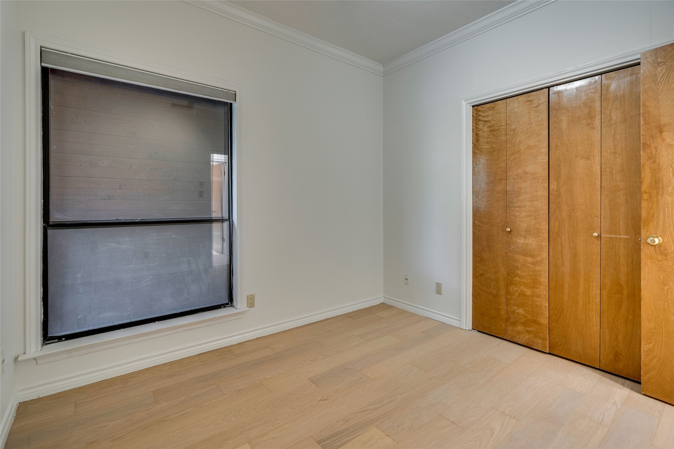 1406 Windsor Road, Unit 201 Austin, TX 78703 - Photo 25 of 32 an empty room with windows