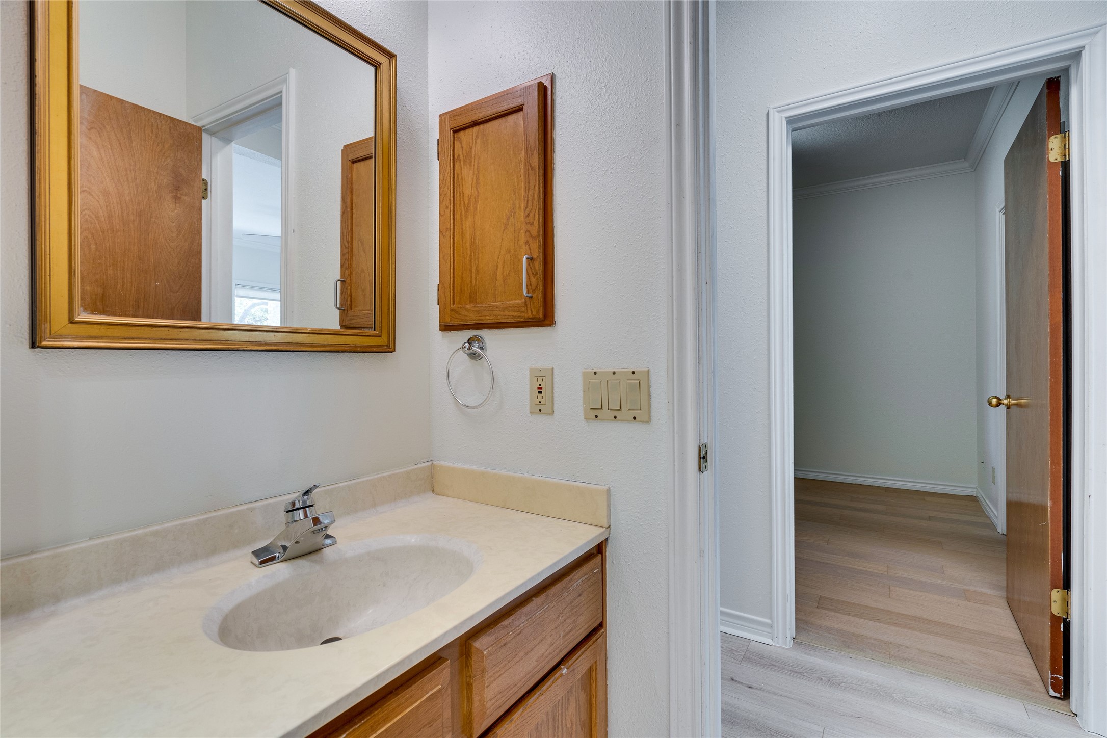 1406 Windsor Road, Unit 201 Austin, TX 78703 - Photo 27 of 32 a bathroom with a sink and a mirror