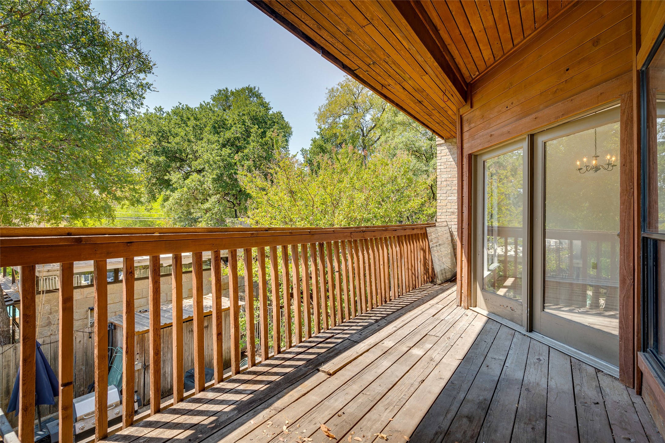 1406 Windsor Road, Unit 201 Austin, TX 78703 - Photo 30 of 32 a view of balcony with wooden floor
