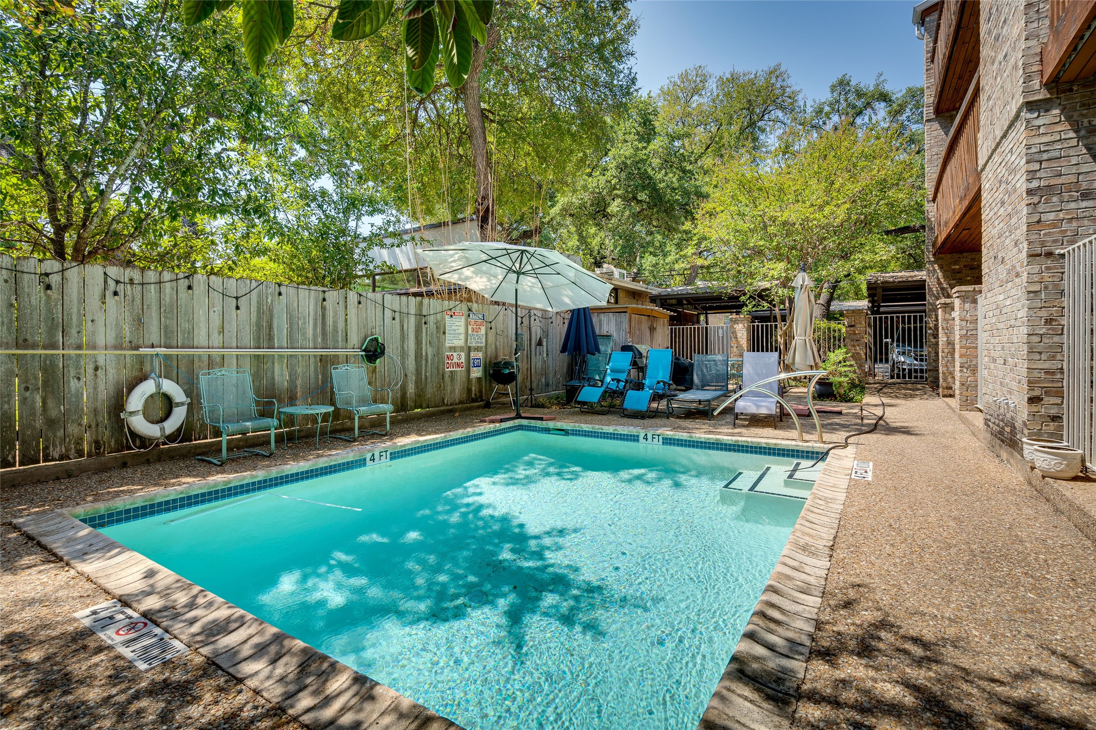 1406 Windsor Road, Unit 201 Austin, TX 78703 - Photo 31 of 32 a view of a backyard with sitting area and furniture