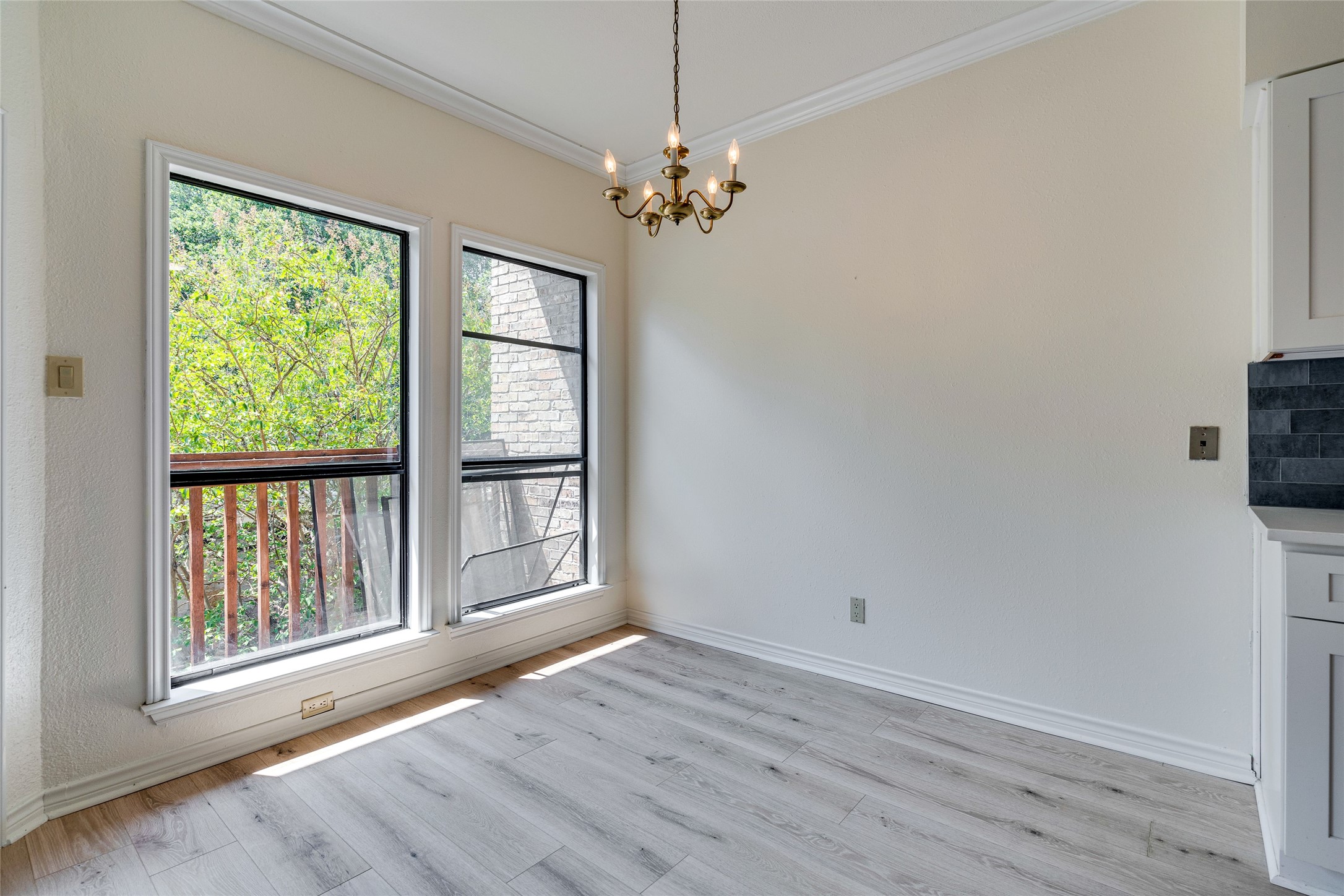 1406 Windsor Road, Unit 201 Austin, TX 78703 - Photo 7 of 32 a view of livingroom with hardwood floor and window