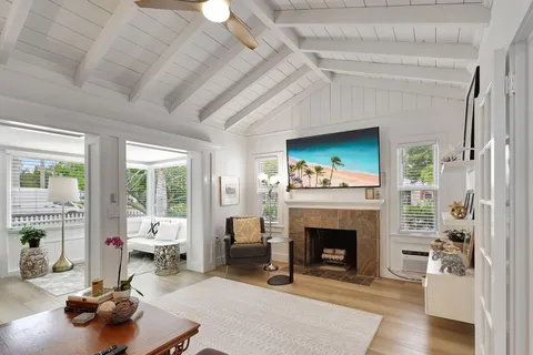 a living room with furniture and a rug