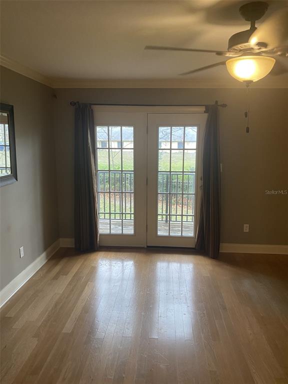 246 Afton Square, Unit 203 Altamonte Springs, FL 32714 - Photo 11 of 26 a view of room window and wooden floor