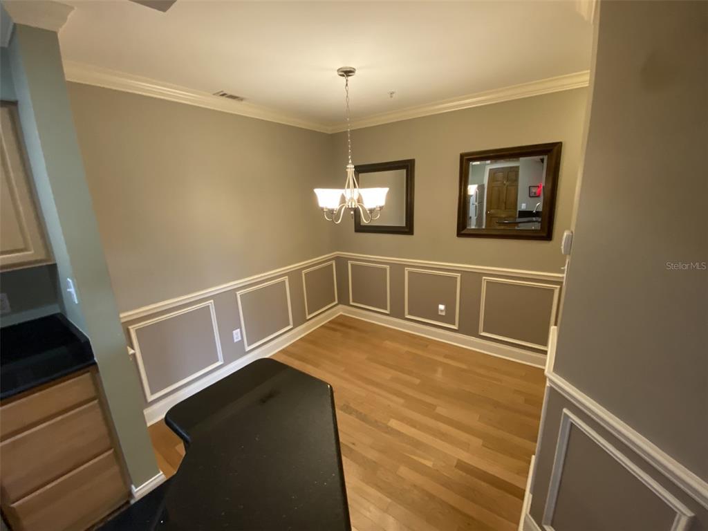 246 Afton Square, Unit 203 Altamonte Springs, FL 32714 - Photo 13 of 26 a view of an entryway with wooden floor