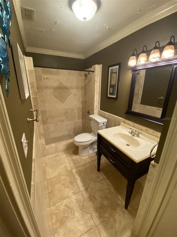 246 Afton Square, Unit 203 Altamonte Springs, FL 32714 - Photo 15 of 26 a bathroom with a sink a toilet and mirror
