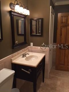 246 Afton Square, Unit 203 Altamonte Springs, FL 32714 - Photo 17 of 26 a bathroom with a sink and a mirror