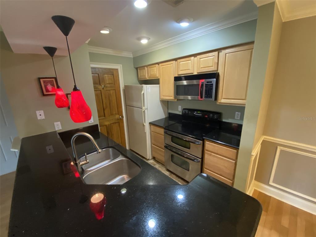 246 Afton Square, Unit 203 Altamonte Springs, FL 32714 - Photo 5 of 26 a room with furniture and gym equipment